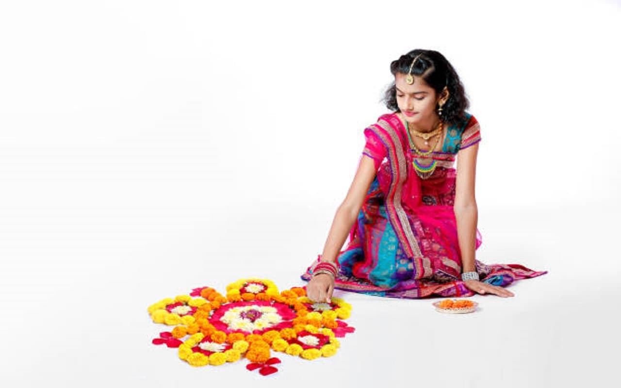 Making rangoli has special importance Making rangoli has special importance