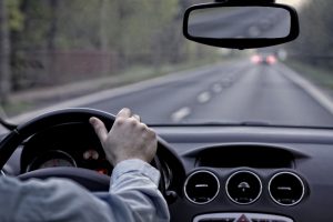 person-driving-car-over-shoulder