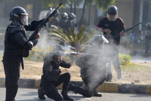 Pakistan Police officers fire rubber bullets to disperse supporters of former PM Imran Khan