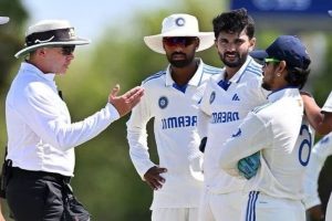 Ishan Kishan with Umpire Shawn Craig. Image: Social Media